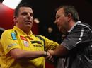 Dave Chisnall is congratulated by Phil Taylor