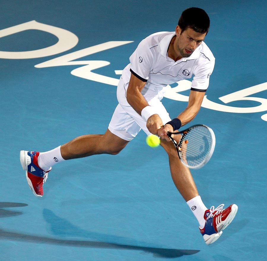 Novak Djokovic scoops the ball back
