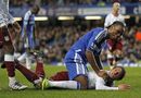Didier Drogba sees the funny side after falling on to Stephen Warnock