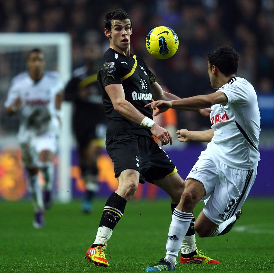 Gareth Bale runs at Neil Taylor