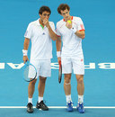 Andy Murray discusses tactics with Marcos Baghdatis