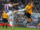 James Morrison challenges Tim Cahill for the ball