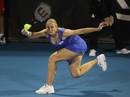 Jelena Dokic gets down low to hit a return