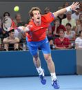 Andy Murray stretches to return serve against Gilles Muller