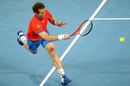 Andy Murray hits a forehand on the run