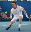 Andy Murray stoops to make a drop shot