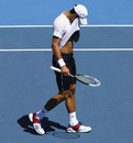 Novak Djokovic wipes away some sweat 