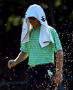 Louis Oosthuizen protects himself from the heat