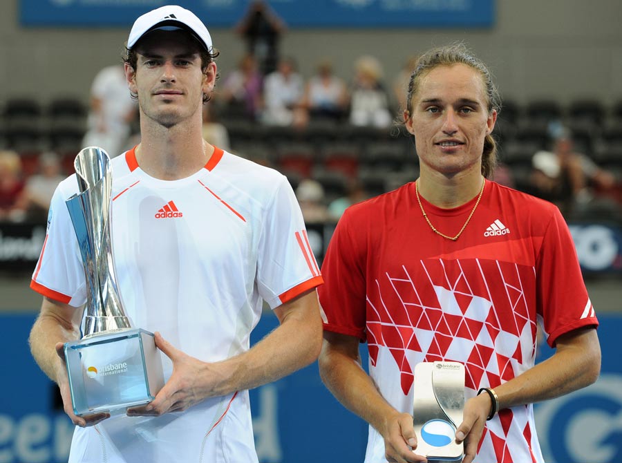 Andy Murray poses with the winner's trophy 