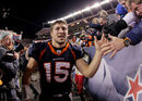 Tim Tebow celebrates victory with fans