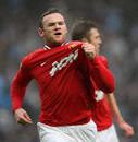 Wayne Rooney salutes the Manchester United badge
