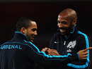 Thierry Henry and Theo Walcott share a joke