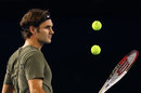 Roger Federer juggles a few balls