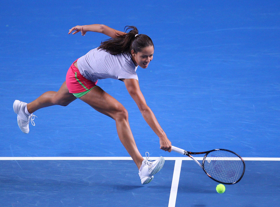 Ana Ivanovic stretches for a ball in practice