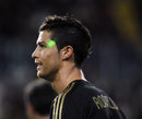 Real Madrid's Cristiano Ronaldo is targeted with a laser pointer