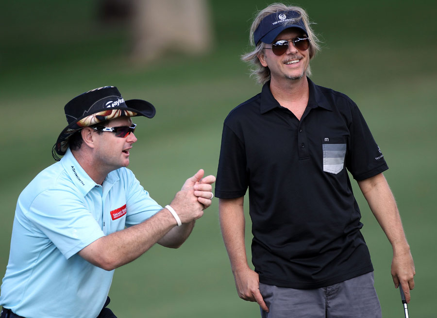Rory Sabbatini shares a joke with actor David Spade during the pro-am