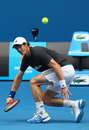 Andy Murray stretches for a ball in practice