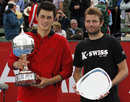 Bernard Tomic and Mardy Fish pose with their trophies