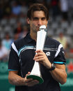 David Ferrer kisses his new trophy