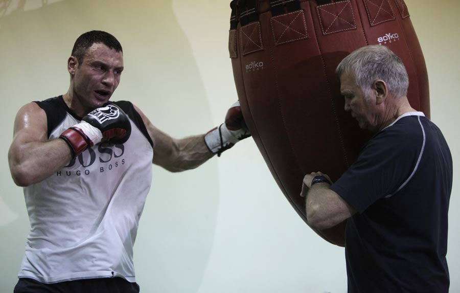 Vitali Klitschko lands a left hook on the punchbag