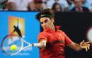Roger Federer smacks a forehand