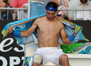 Rafael Nadal towels himself off during a break in play