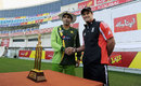 Pakistan captain Misbah-ul-Haq shakes hands with his England counterpart Andrew Strauss over the series trophy