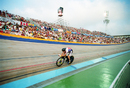 Chris Boardman races around the velodrome on his Lotus-engineered bike