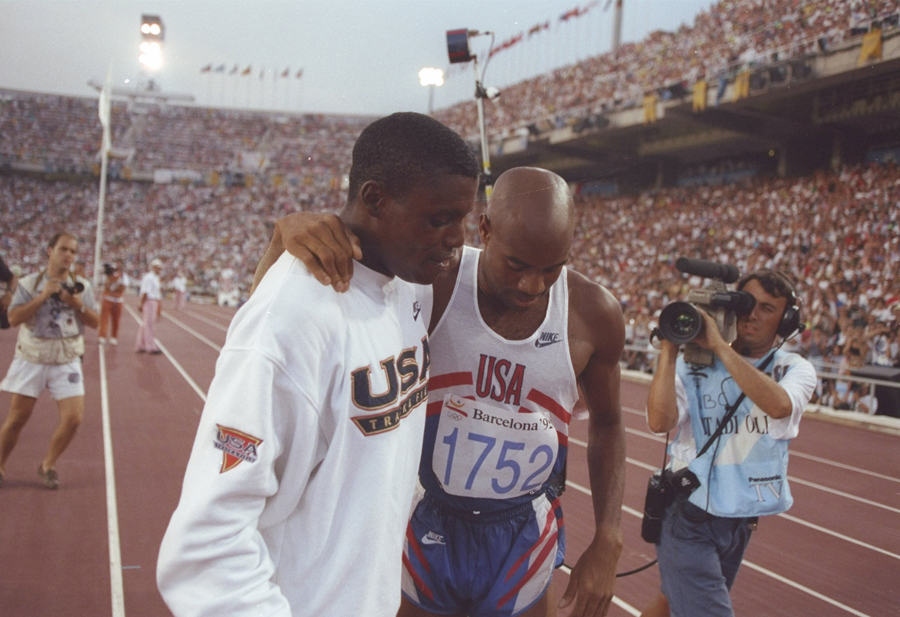 Carl Lewis comiserates with Mike Powell after winning the long jump final