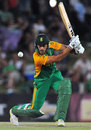 Faf du Plessis plays a cover drive 