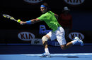 Rafael Nadal stretches to reach a backhand