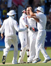 Jonathan Trott is congratulated after taking a wicket