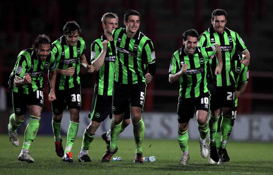 Brighton players celebrate after clinching victory in a penalty shootout