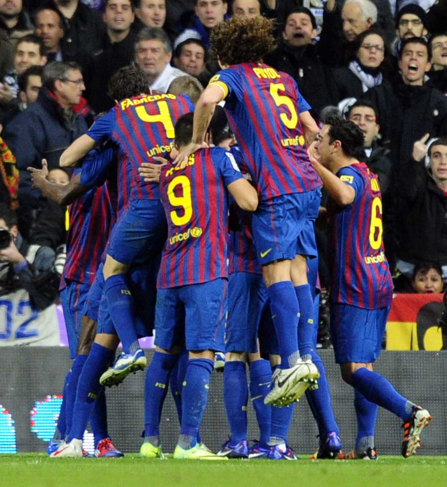 Barcelona's players celebrate after Eric Abidal's goal