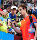 Andy Murray takes the time to sign autographs