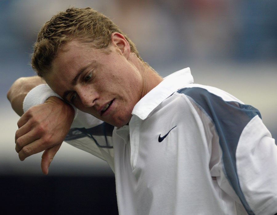 Lleyton Hewitt wipes sweat from his forehead