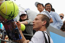 Tomas Berdych signs autographs for fans