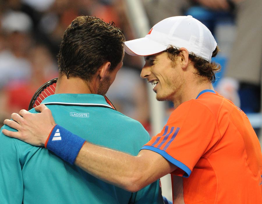 Andy Murray shares a joke with Michael Llodra
