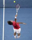 Roger Federer leaps for a smash 