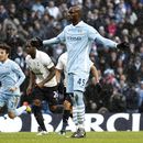 Mario Balotelli reacts after scoring from the penalty spot