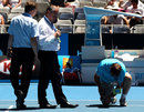 Tennis Australia officials remove surface bubbles