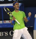 Rafael Nadal reacts after winning a point against Tomas Berdych 