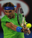 Rafael Nadal hits a backhand in his quarter-final match against Tomas Berdych
