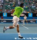 Rafael Nadal plays a backhand in his quarter-final match against Tomas Berdych