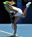 Maria Sharapova powers down a serve
