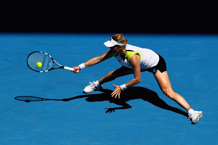 Kim Clijsters stretches for a forehand