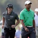 Rory McIlroy and Tiger Woods head for the next hole