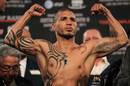 Miguel Cotto flexes his muscles at the weigh-in