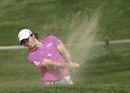 Rory McIlroy plays from a bunker