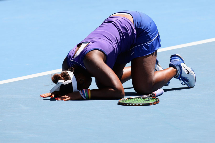 Taylor Townsend falls to the floor in delight